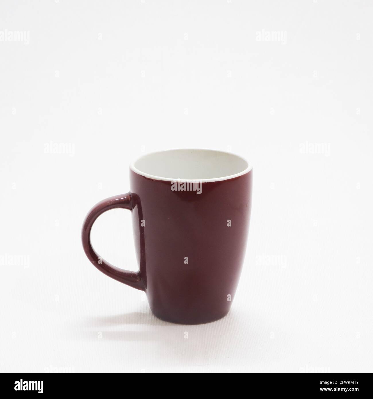 empty plain and simple brown colored coffee cup in a white background Stock Photo