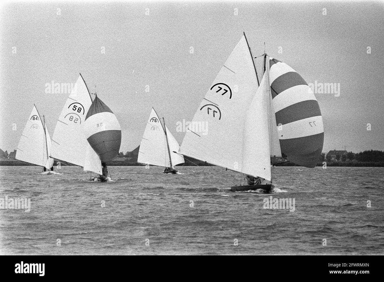 Dutch Championships Rainbow Class sailing on Alkmaardermeer; overview ships with spinnakers, July 19, 1970, CHAMPIONSHIPS, SHIPS, Sails, The Netherlands, 20th century press agency photo, news to remember, documentary, historic photography 1945-1990, visual stories, human history of the Twentieth Century, capturing moments in time Stock Photo