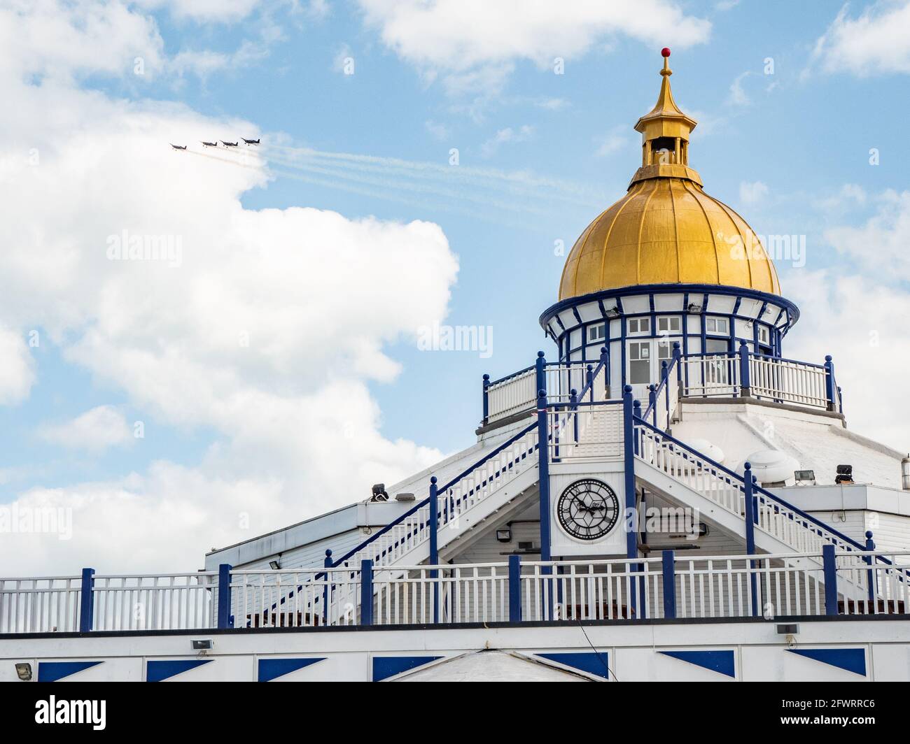 Airbourne Airshow, Eastbourne, England. A formation of vintage fighter planes passing over the dome of the pier at the popular English seaside resort. Stock Photo
