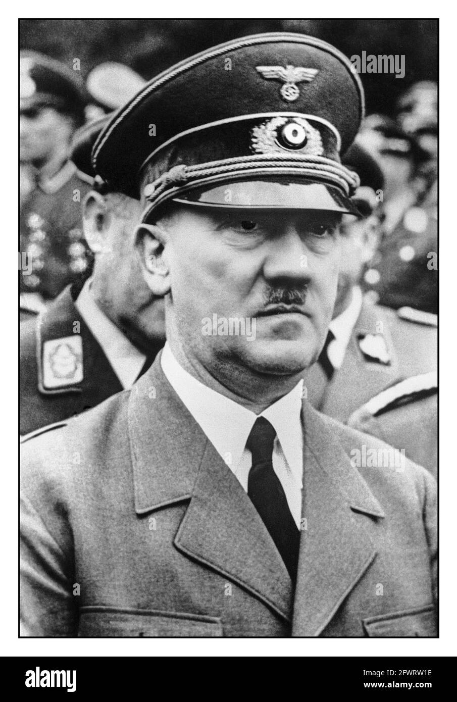 Adolf Hitler WW2 1940's exterior face view in uniform at a military gathering in Nazi Germany Adolf Hitler born: April 20th, 1889 in Braunau am Inn, died: by suicide on April 30th, 1945 in Berlin; in 1920 he took over the leadership of the NSDAP, on January 30, 1933 he became Chancellor and established the fascist dictatorship; on August 2nd, 1934 he made himself head of state and became commander in chief of the armed forces. Adolf Hitler German Führer, (“Leader”), title used by Adolf Hitler to define his role of absolute authority in Germany’s Third Reich (1933–45). Stock Photo