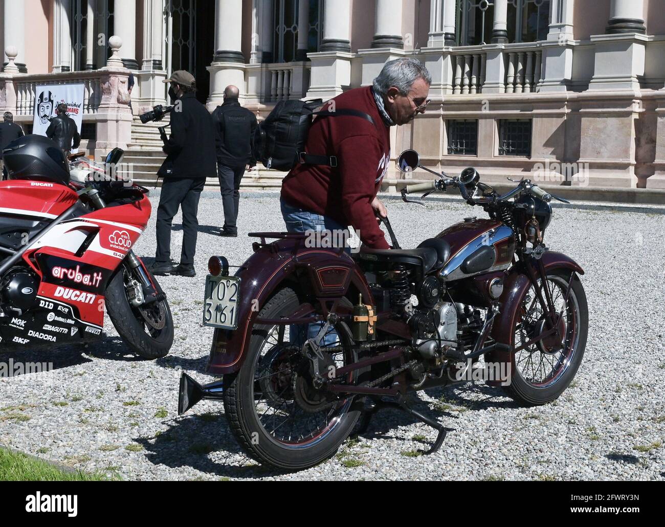 Varese, Italy. 24th May, 2021. Varese, Italy Distinguished Gentleman's Ride world event gathering of motorcyclists of both sexes dressed in vintage and modern style in Varese at Villa Ponti In the photo: motorcyclist with his historic 1930 Guzzi motorcycle Credit: Independent Photo Agency/Alamy Live News Stock Photo