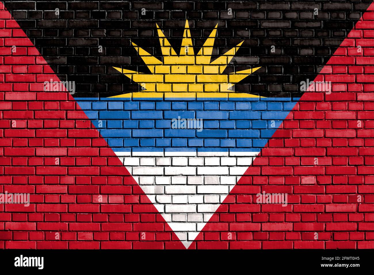 flag of Antigua and Barbuda painted on brick wall Stock Photo