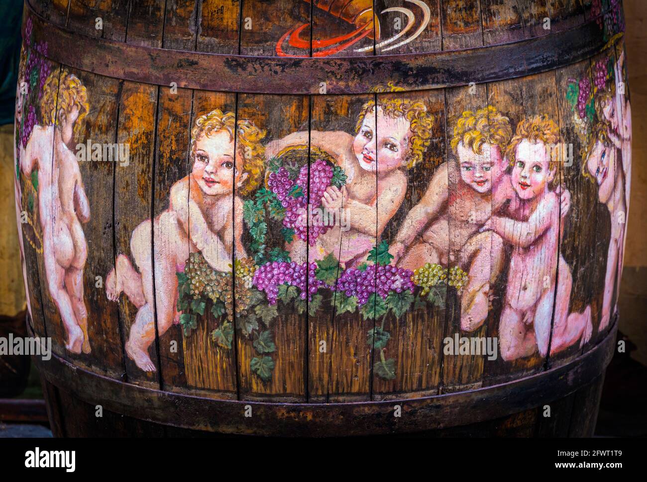 Rome, Italy.  Decorated barrel featuring cherubs in front of Ristorante al Picchio, in Via del Lavatore. Stock Photo