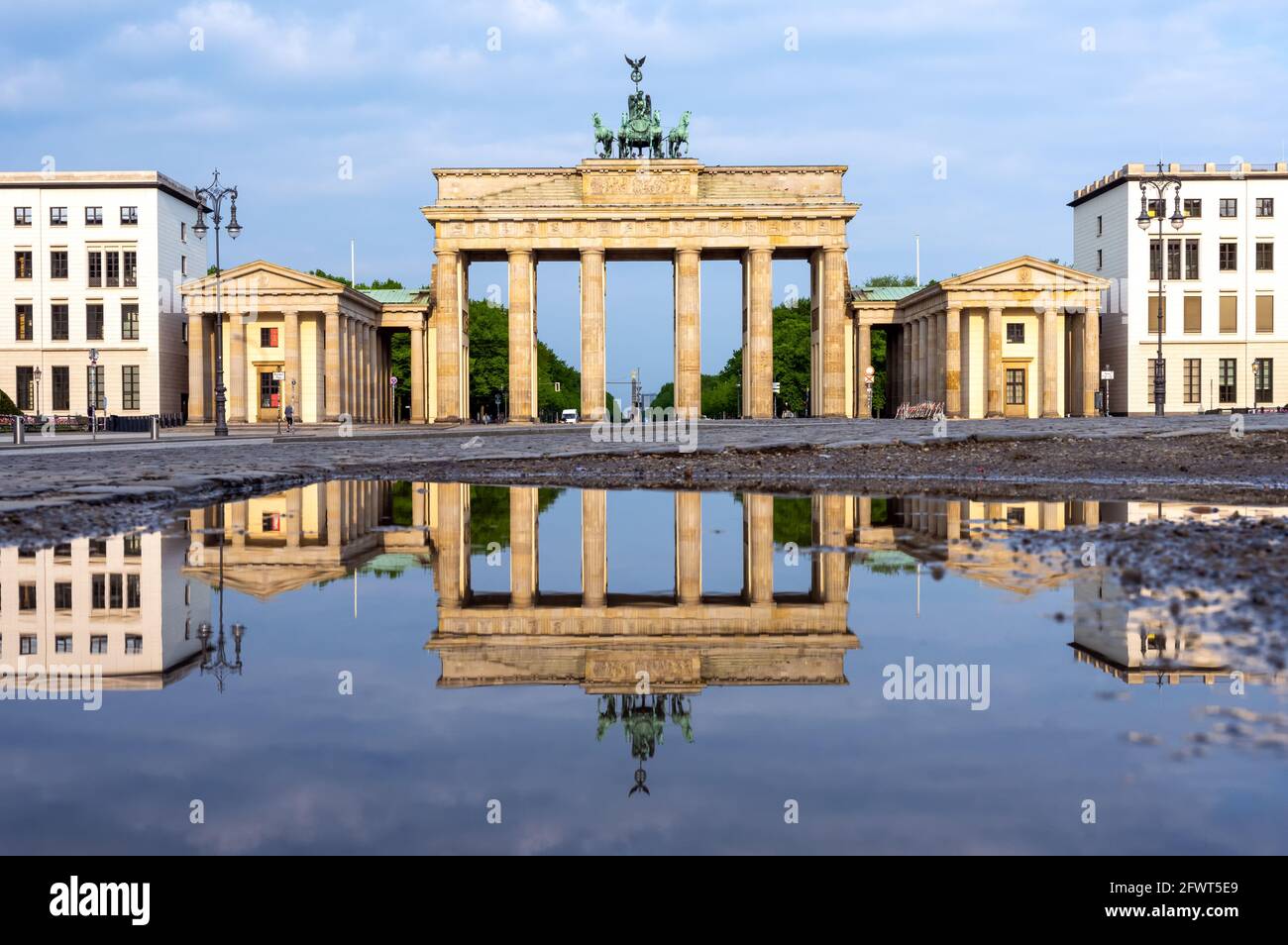 The famous Brandenburger Tor in Berlin reflected in a puddle Stock Photo