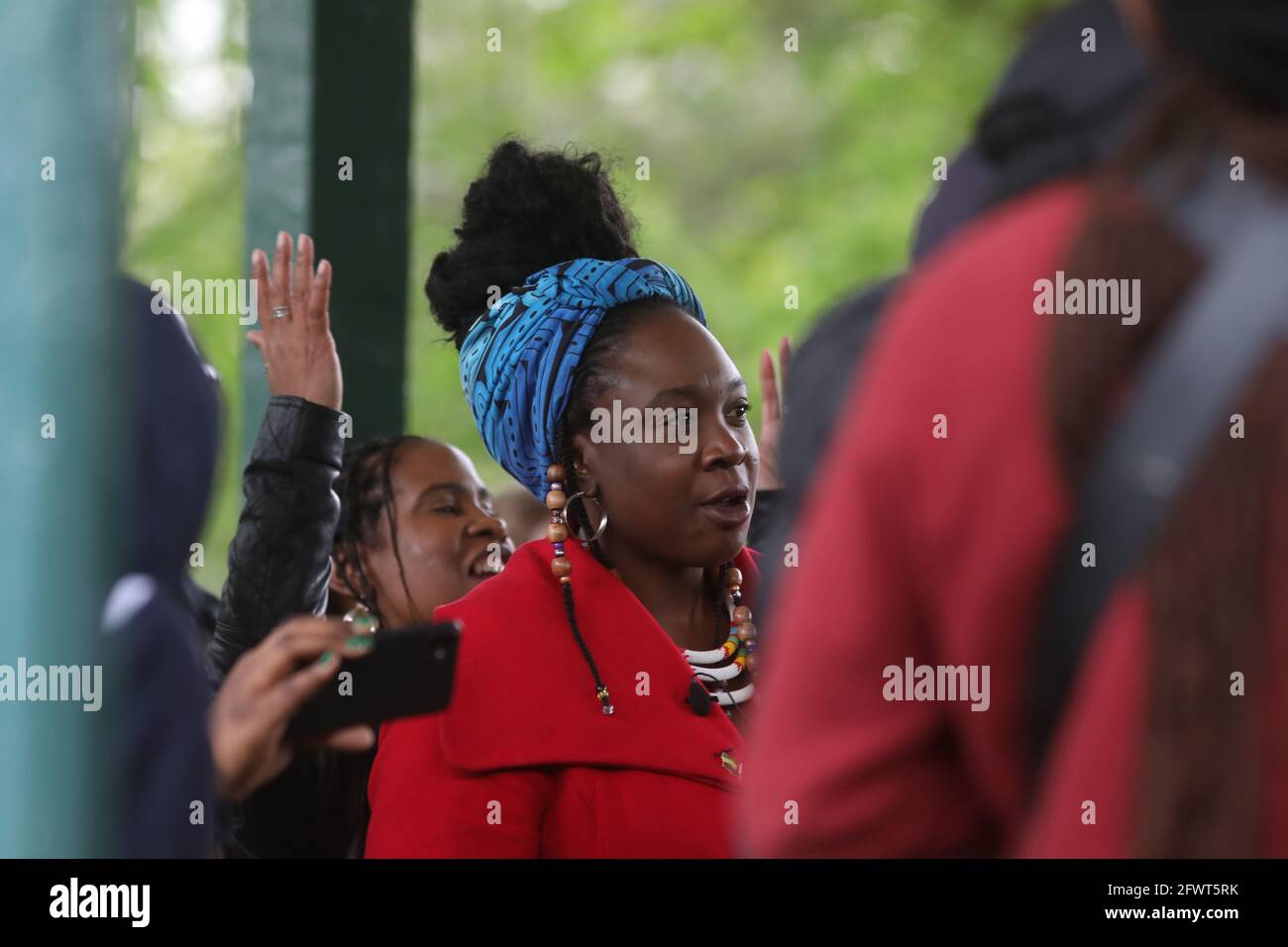 Activist Marvina Eseoghene Newton attends a vigil for equal rights activist Sasha Johnson at the bandstand in Ruskin Park, Camberwell, south London. The mother-of-three remains in criticial condition at King's College Hospital (KCH) after she was shot in the head outside a house party in Peckham during the early hours of Sunday. Picture date: Monday May 24, 2021. Stock Photo