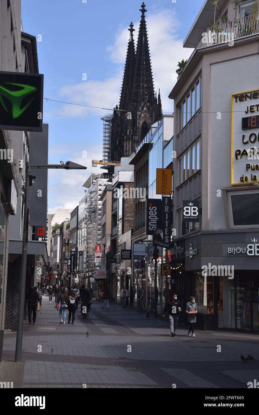 Cologne, Germany. 23rd May, 2021. The shopping street Hohe Strasse in Cologne, in the background the Cologne Cathedral. Credit: Horst Galuschka/dpa/Alamy Live News Stock Photo