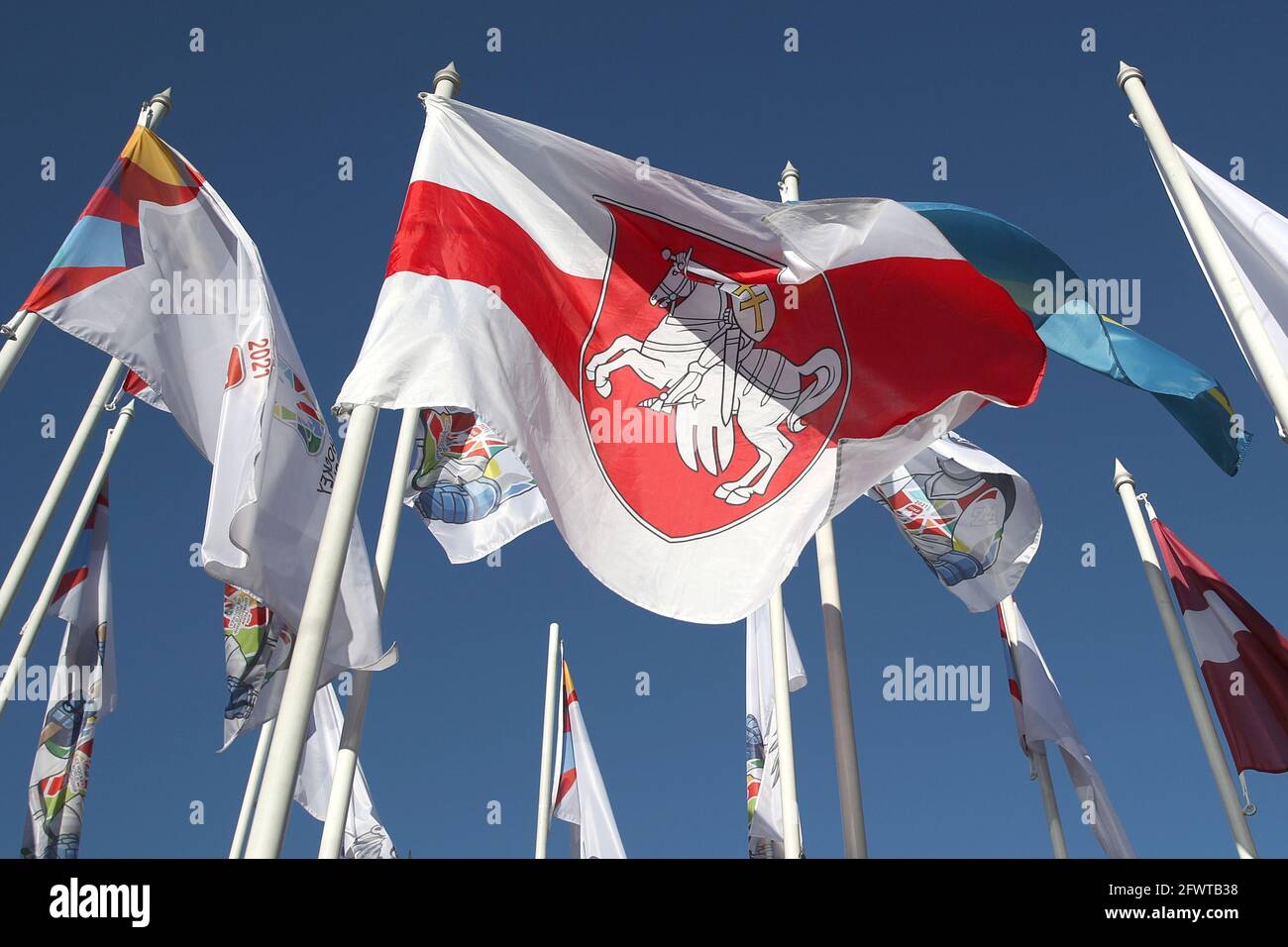 RIGA, LATVIA - MAY 24, 2021: A white-red-white flag (C) waves outside the Radisson  Blu Hotel Latvija in central Riga where participants in the 2021 IIHF World  Championship live. The Belarusian flag