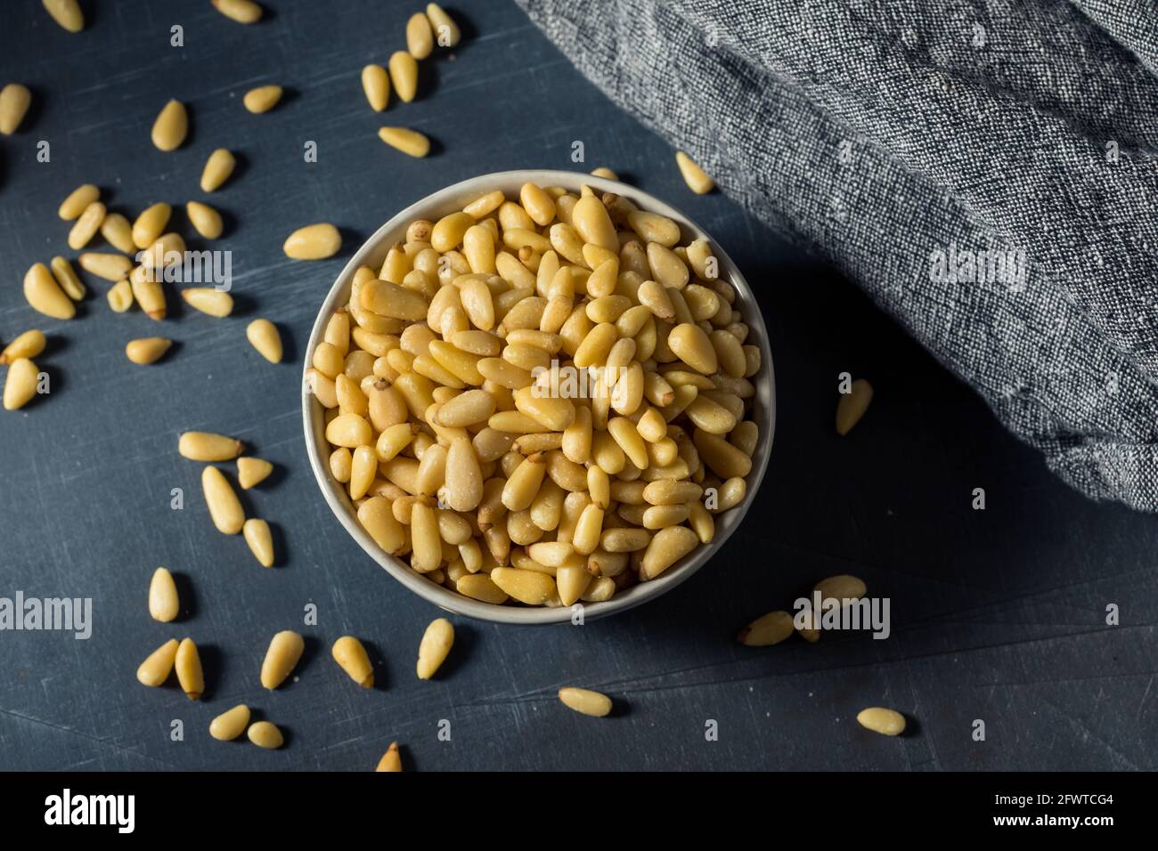 Raw Organic Pine Nuts in a Bowl Stock Photo