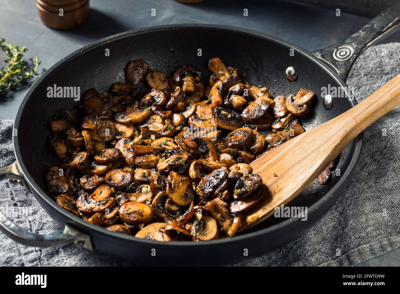 Homemade Healthy Sauteed Mushrooms with Butter and Thyme Stock Photo