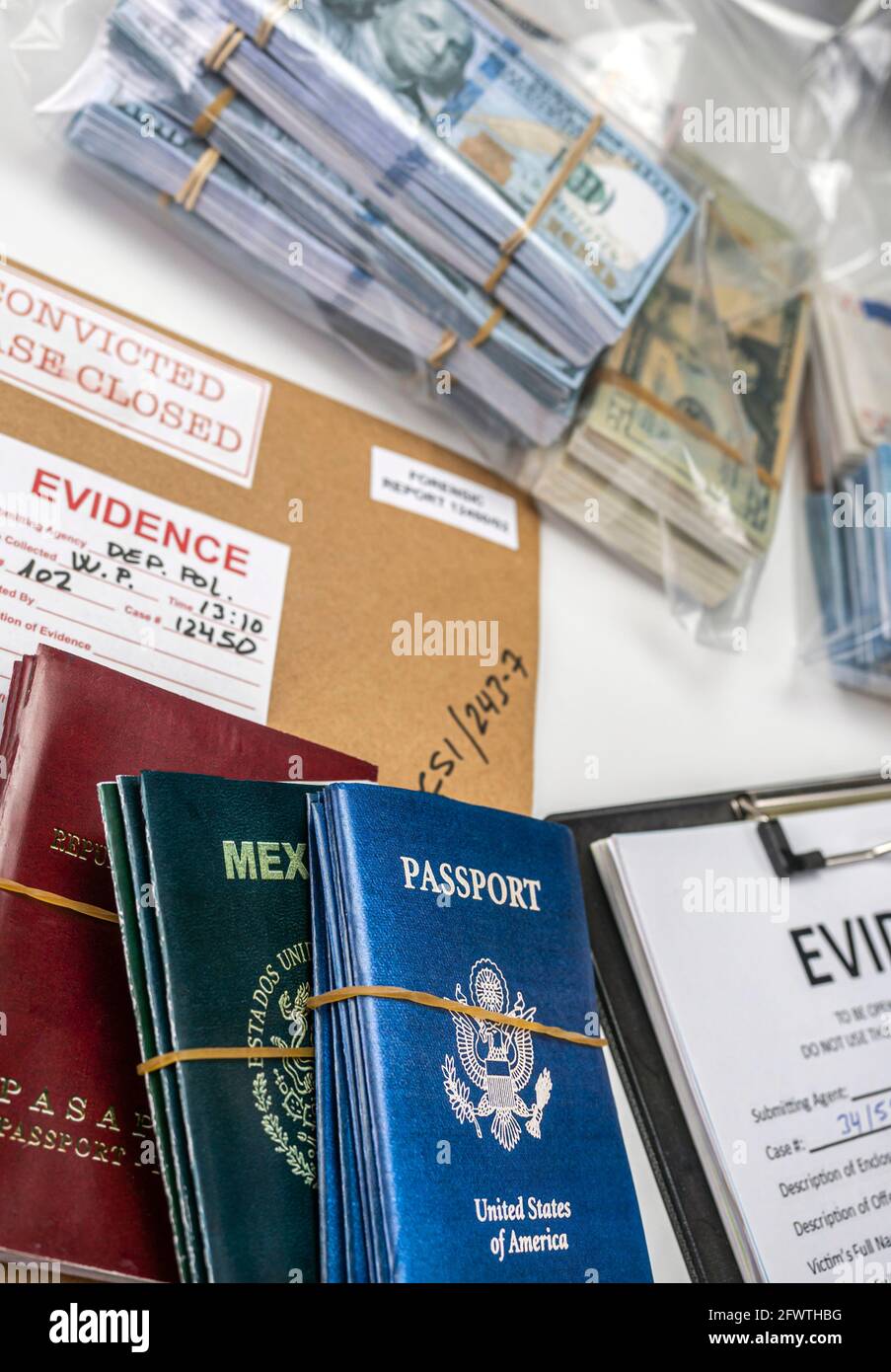 Different passports decommissioned in police investigation unit, conceptual image Stock Photo