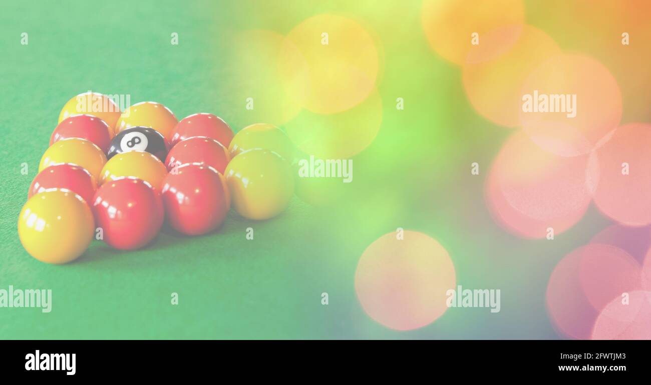 Composition of snooker balls on snooker table with orange and yellow