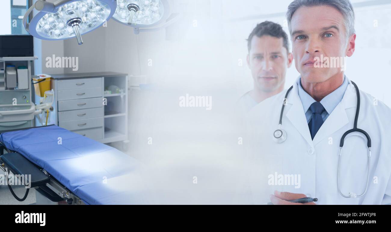 Composition of diverse group of doctors and operating theatre with motion blur Stock Photo