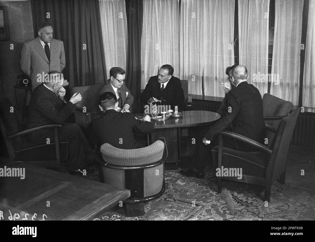 Signing of Belgian-Dutch Treaty on Mutuality of Social Insurance. Minister Drees with Belgian Minister L.E. Troclet and officials for the signing, 29 August 1947, international agreements, ministers, The Netherlands, 20th century press agency photo, news to remember, documentary, historic photography 1945-1990, visual stories, human history of the Twentieth Century, capturing moments in time Stock Photo