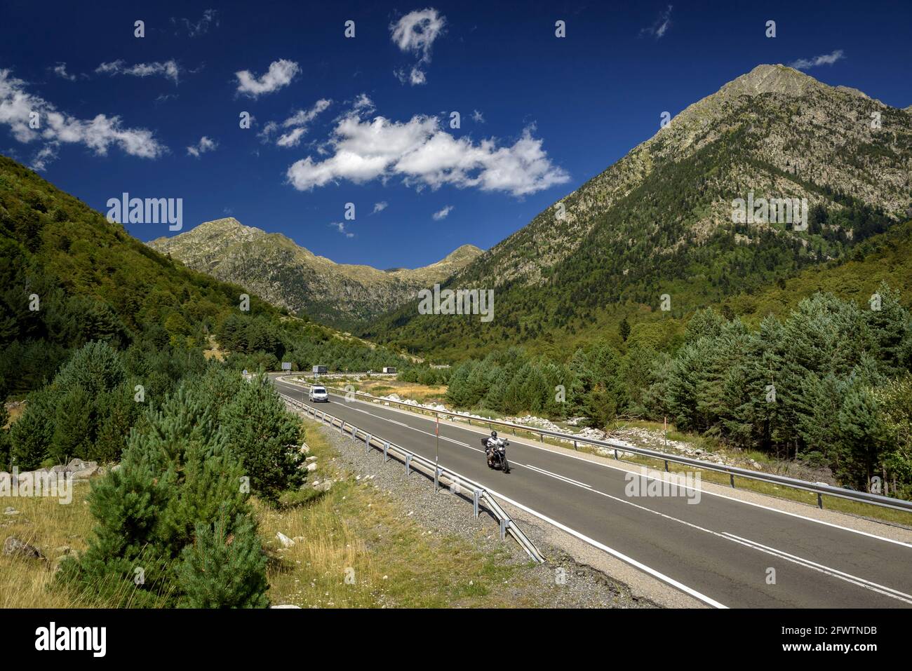 Road through the Barrabés valley, near the southern mouth of the Vielha Tunnel (Aran Valley, Catalonia, Spain, Pyrenees) Stock Photo