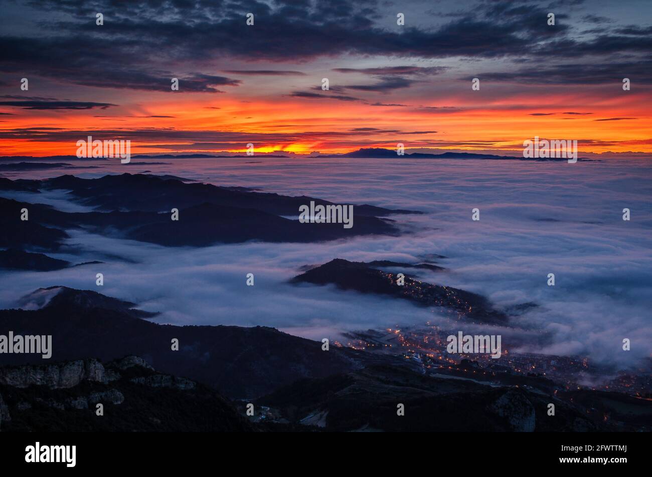 Winter sunrise seen from the Figuerassa viewpoint, with a sea of clouds in central Catalonia (Berguedà, Barcelona, Catalonia, Spain, Pyrenees) Stock Photo
