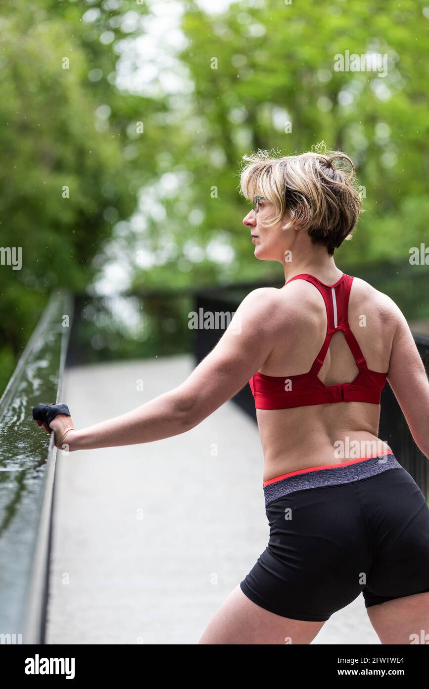 Woman posing in a city park after working out Stock Photo