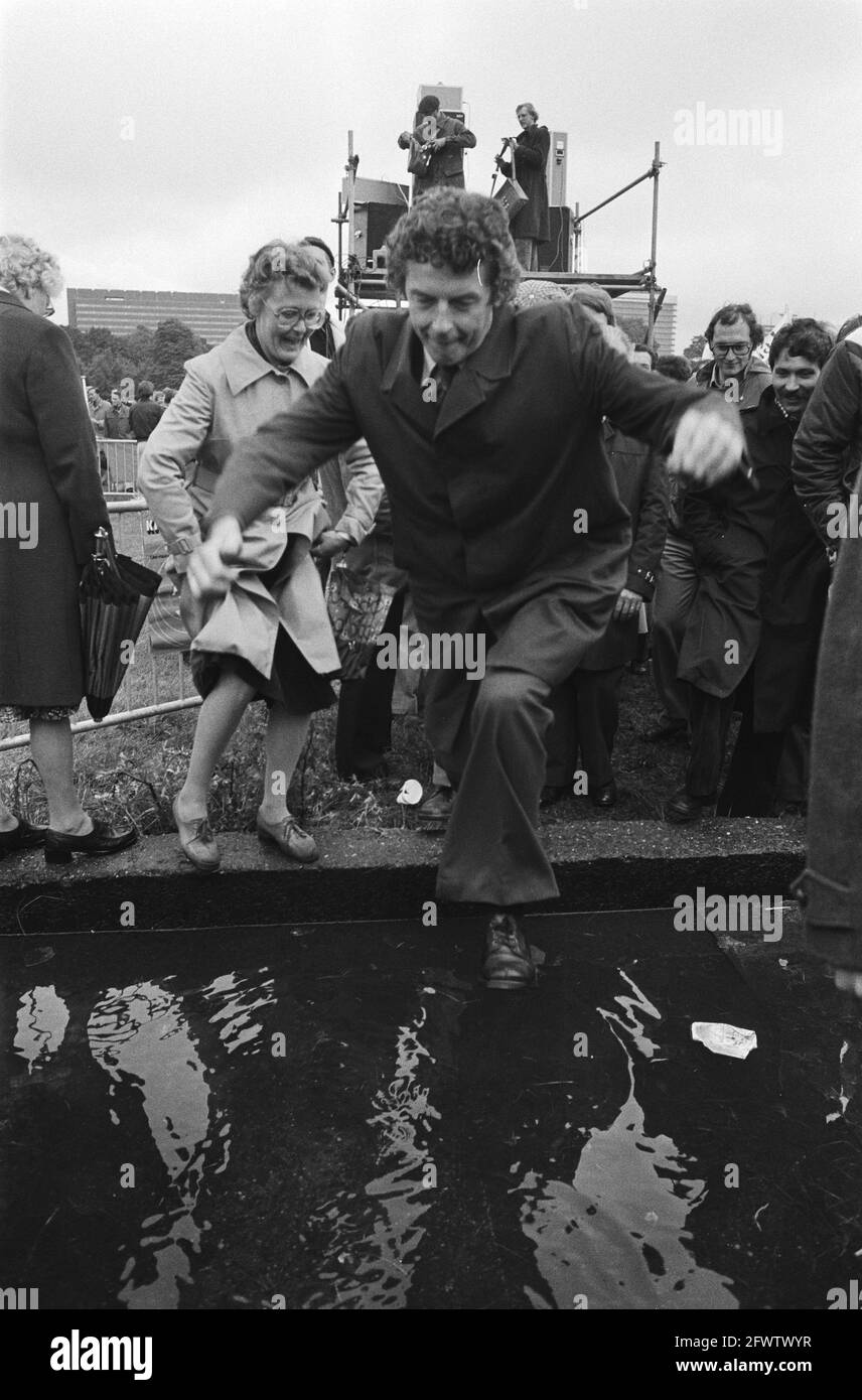 Civil Servants Demonstration, The Hague against Van Agt's Cutbacks Plans, Wim Kok jumps over puddle, June 26, 1978, Civil Servants, Cutbacks, Demonstrations, The Netherlands, 20th century press agency photo, news to remember, documentary, historic photography 1945-1990, visual stories, human history of the Twentieth Century, capturing moments in time Stock Photo