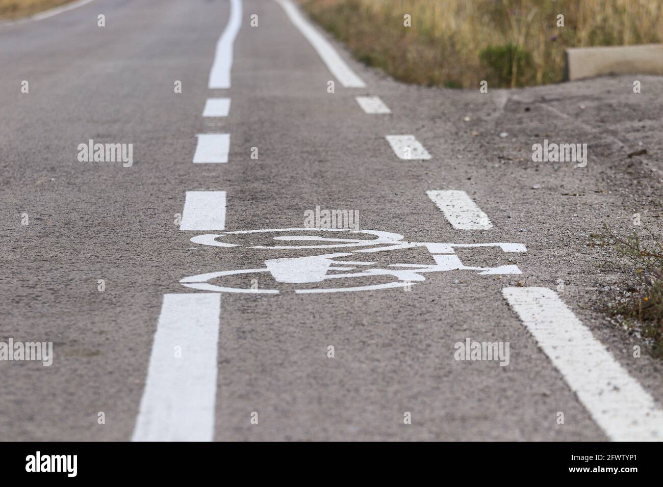 Road with bicycle path. Bicycle lane signage Stock Photo