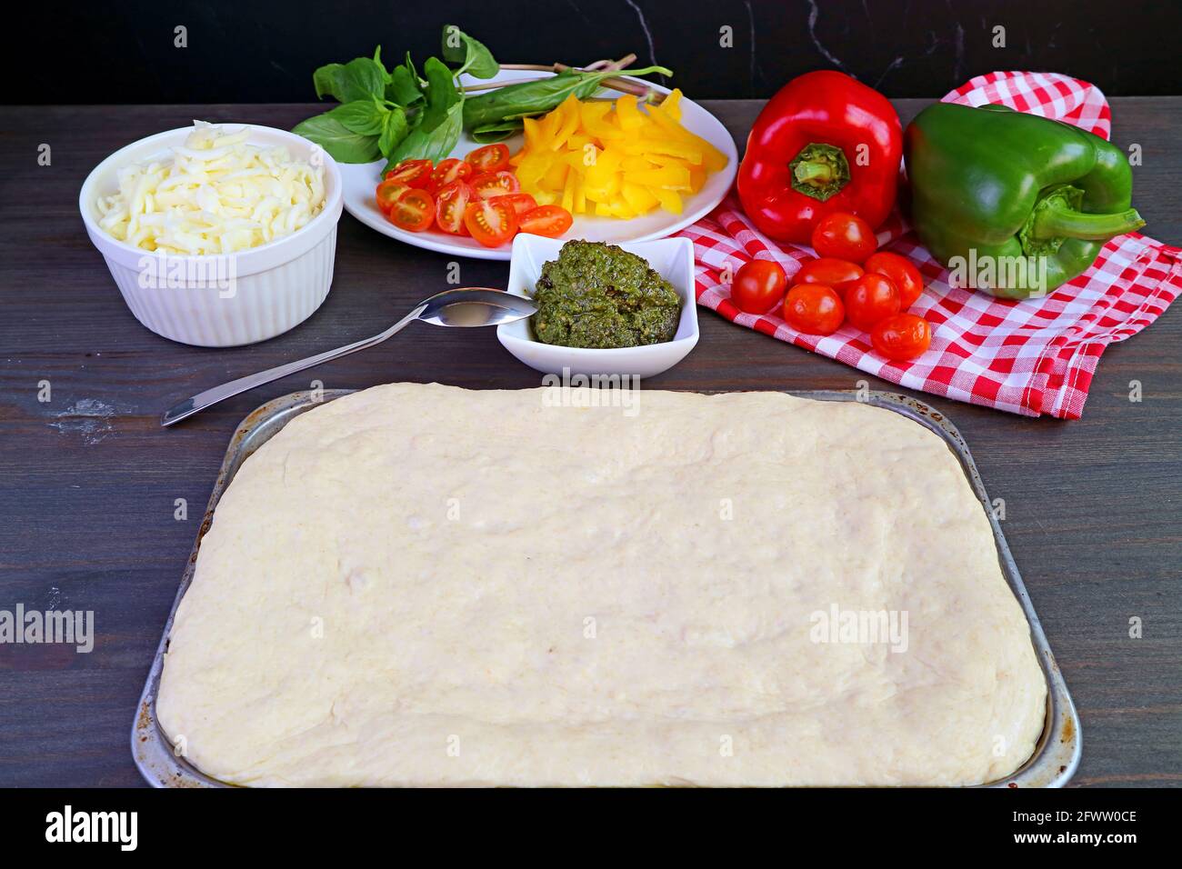 Pizza dough on a sheet pan ready for the next process of preparation Stock Photo