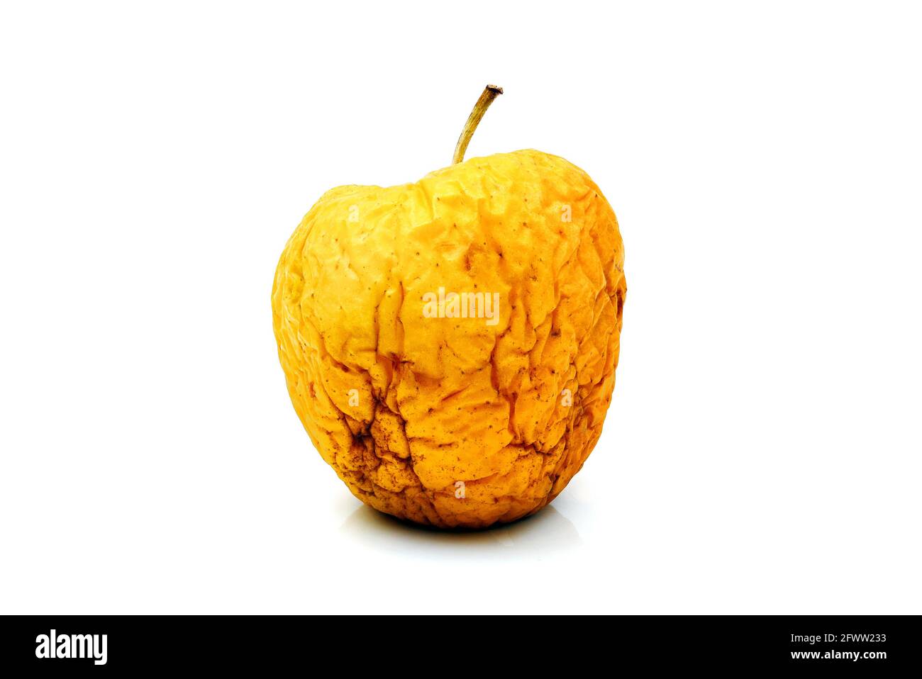 wizened wrinkled yellow apple isolated on white background Stock Photo ...