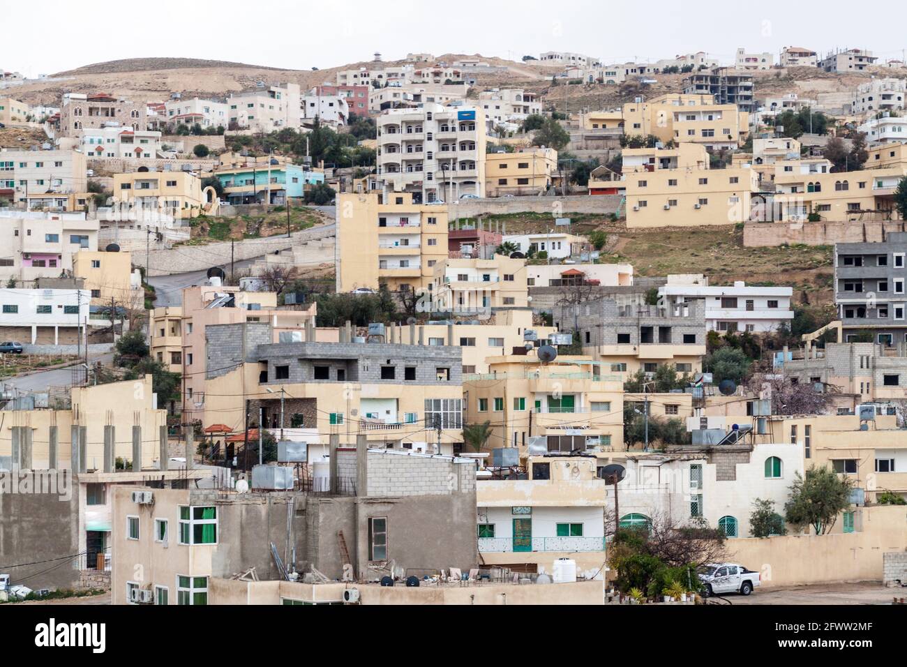 Buildings of Wadi Musa, town located near the archaeological site Petra, Jordan Stock Photo