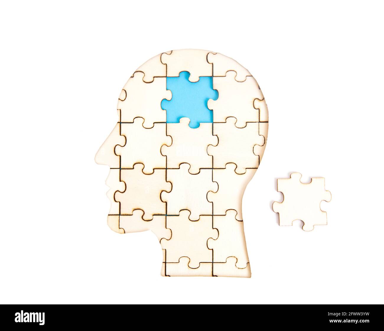 Human head profile shaped jigsaw puzzle with the final piece to be set in place isolated on white. Business idea and expertise implementation concept. Stock Photo