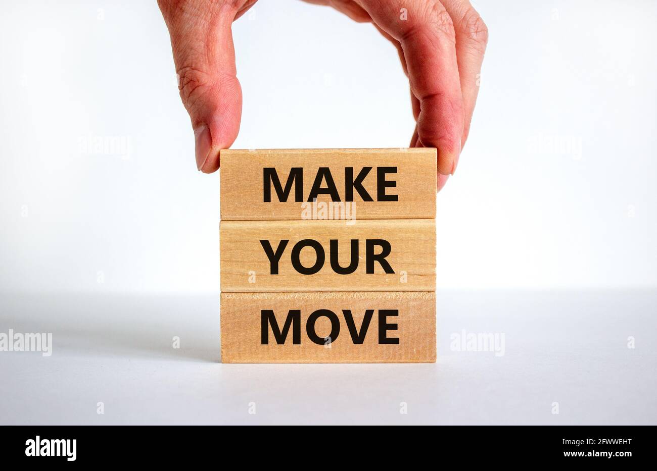 Make your move symbol. Wooden blocks with words 'Make your move ...