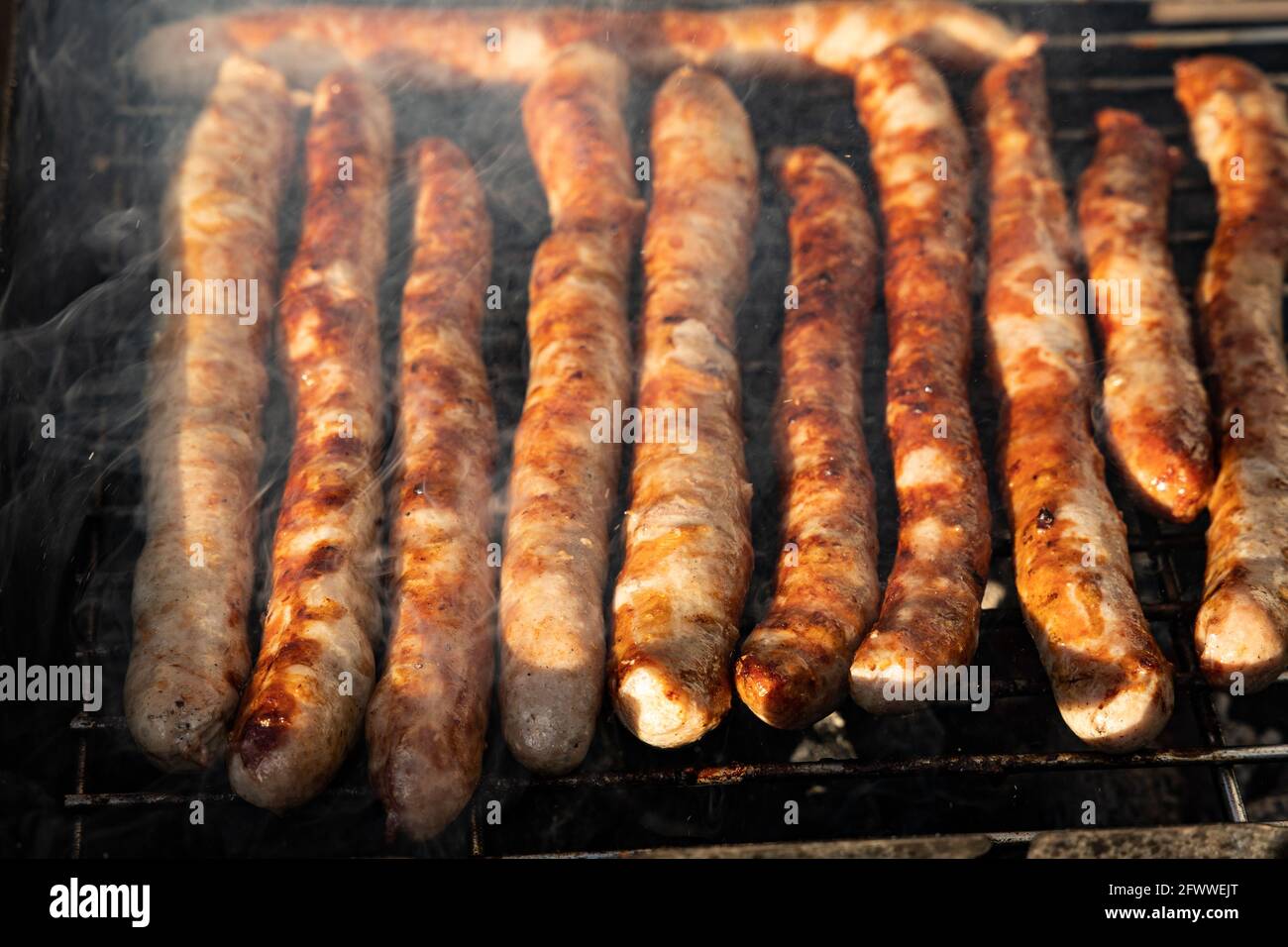 german sausages on a charcoal grill Stock Photo Alamy