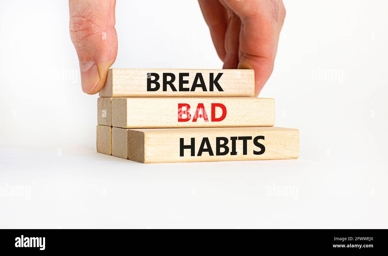 Break bad habits symbol. Wooden blocks with words 'break bad habits ...