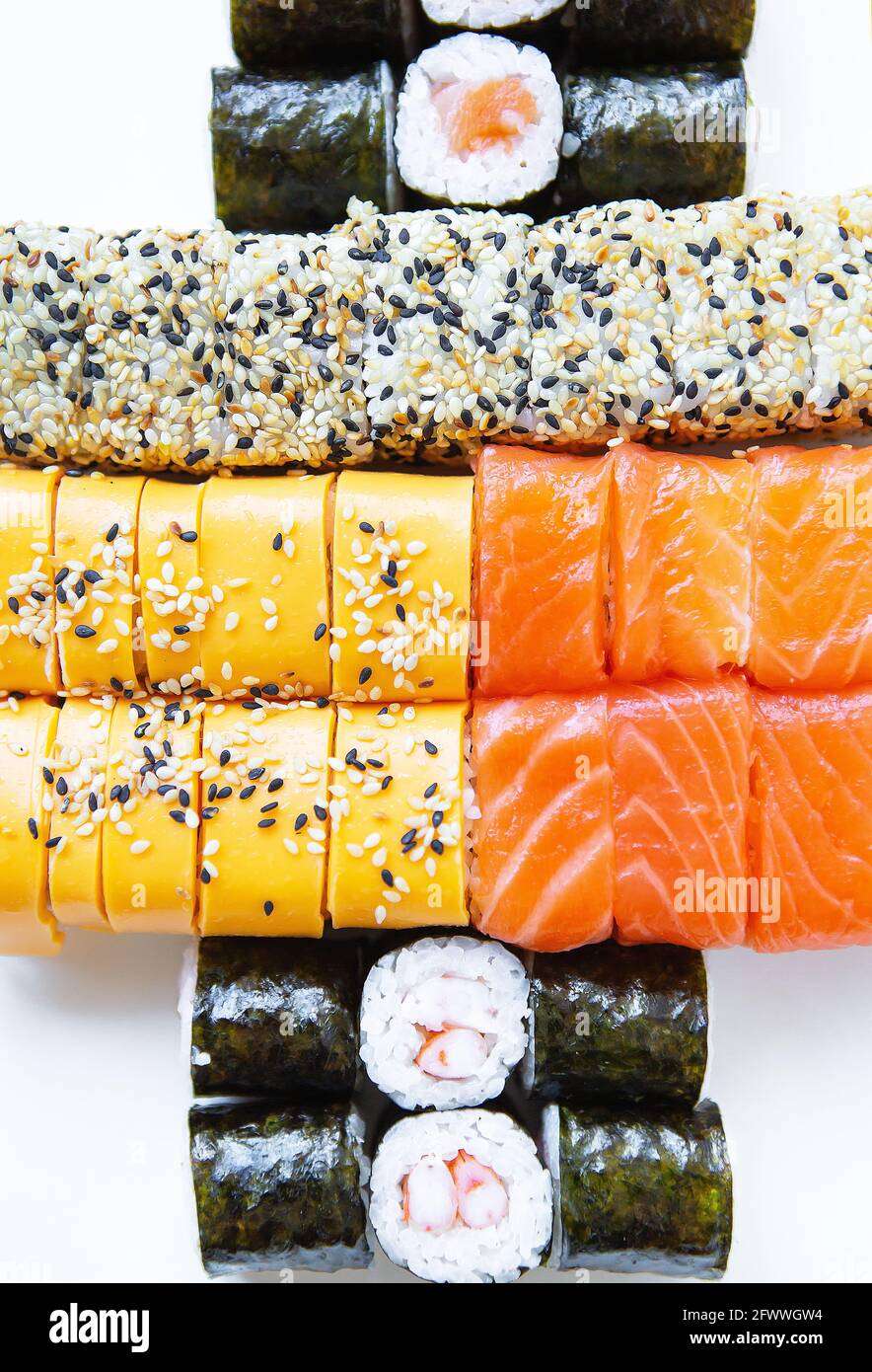 Sushi from Japanese cuisine. There are different types of sushi in the box.  Delicious and healthy food delivery concept. View from above Stock Photo -  Alamy