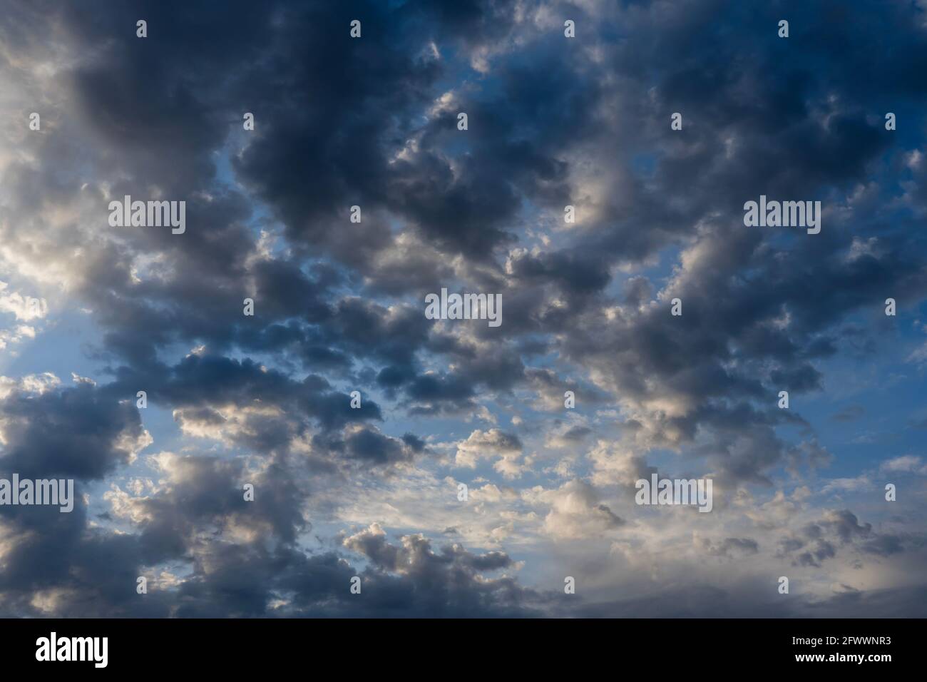 Beautiful clouds of different shapes in the sky before sunset Stock ...