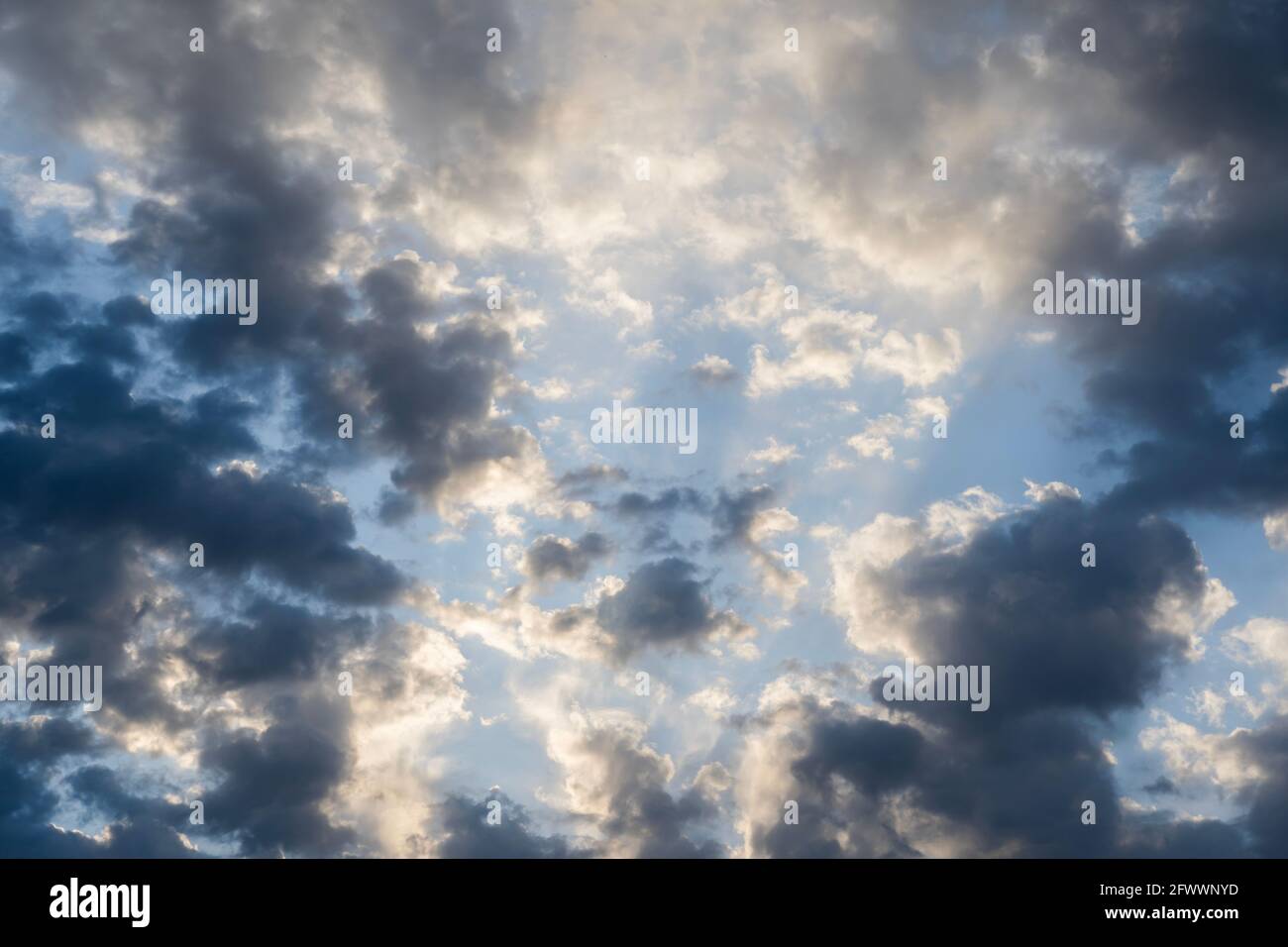 Beautiful clouds of different shapes in the sky before sunset Stock ...