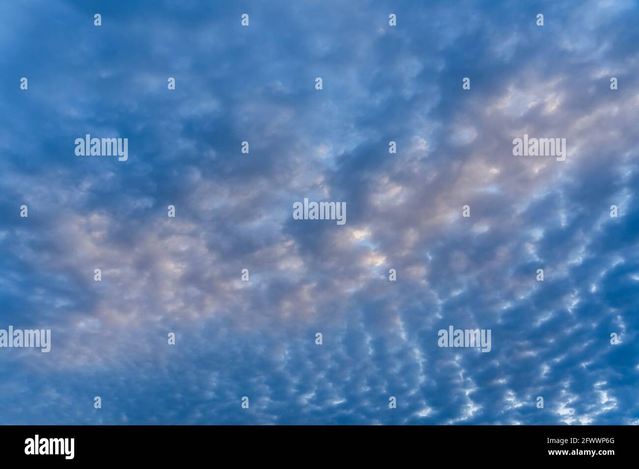 Beautiful clouds of different shapes in the sky before sunset Stock ...