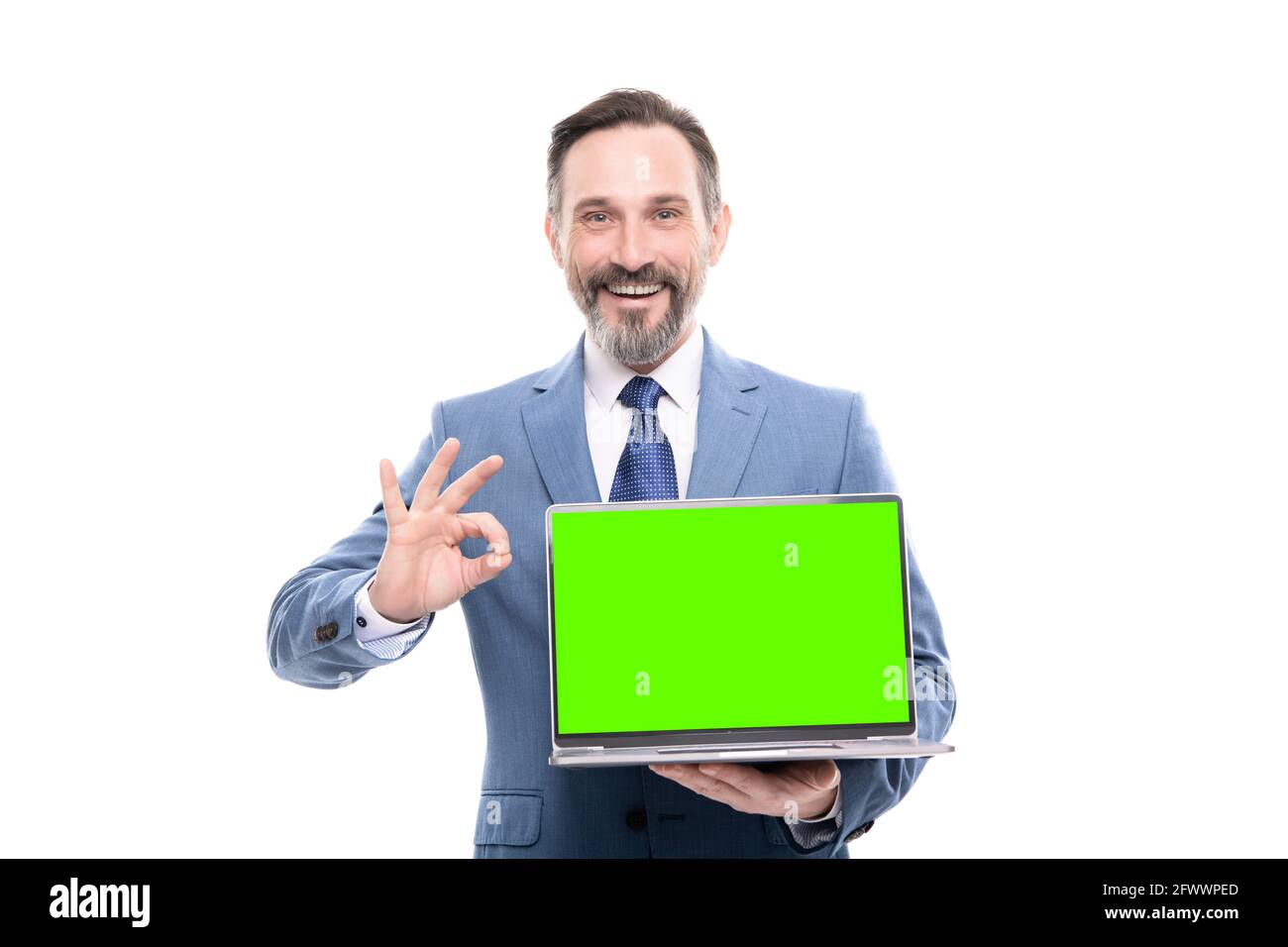 office manager ready for video conference. happy grizzled man showing laptop screen. Stock Photo