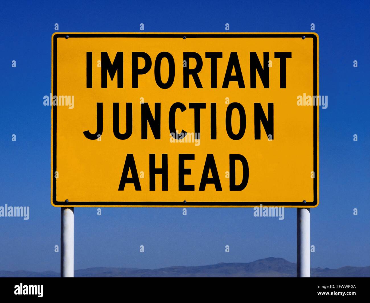 Important Junction Ahead Sign Stock Photo