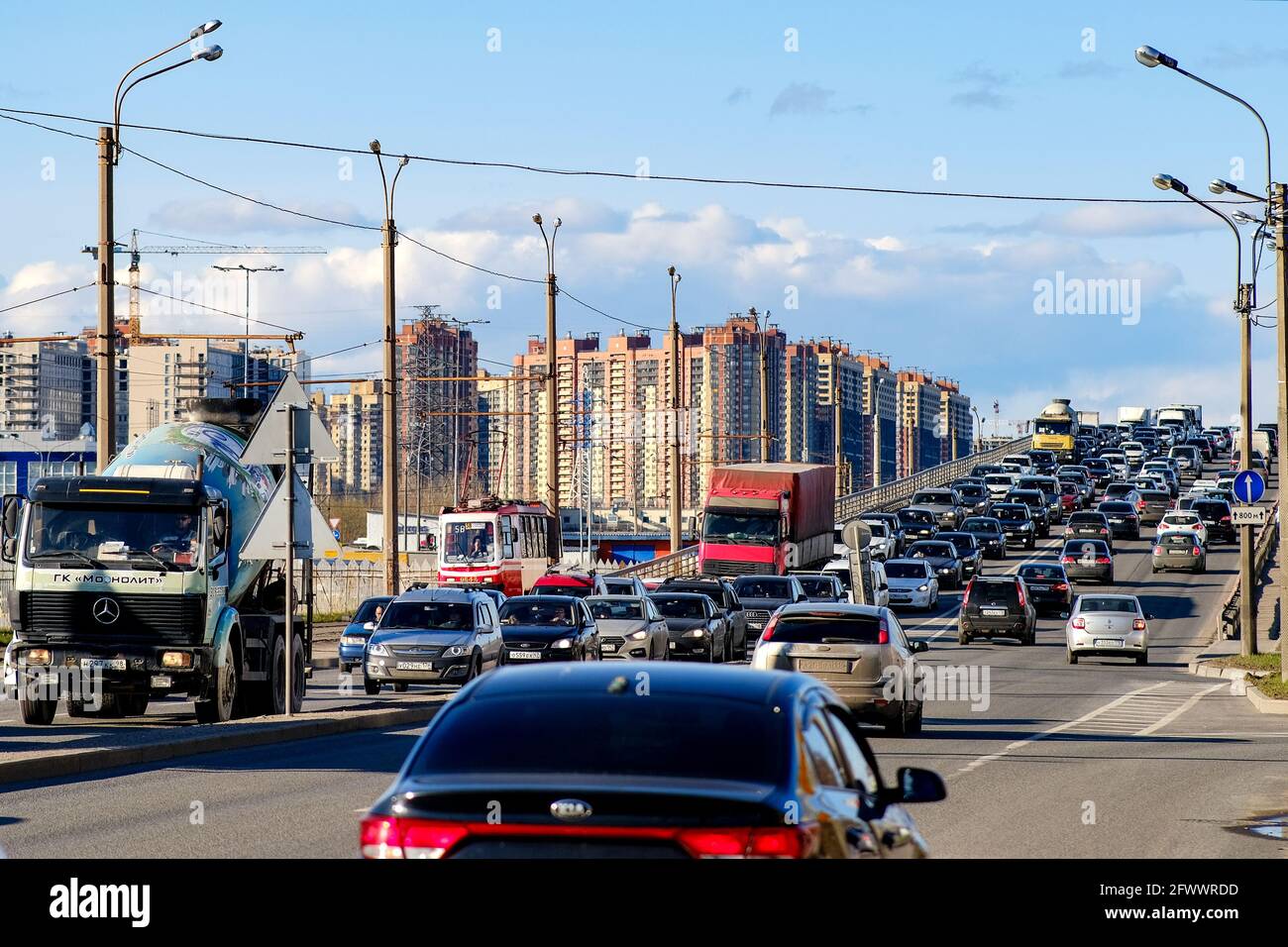 Traffic jams on the streets of the city. Red brake lights of stopped cars on the background of the city surroundings.Saint-Petersburg. Russia. April 3 Stock Photo