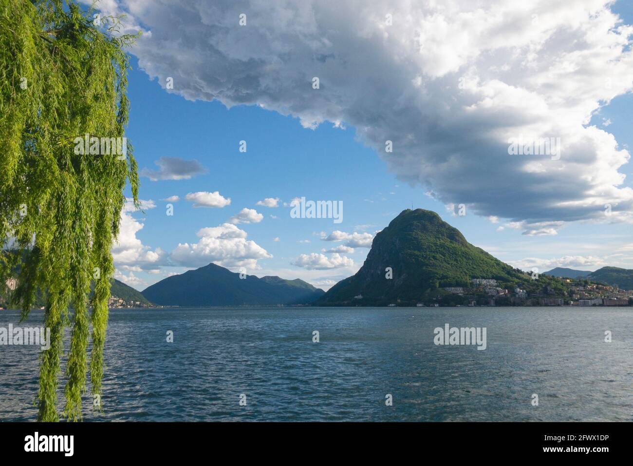 Landscape view of the beautiful Monte San Salvatore (also known as Mount San Salvatore) and the lake Lugano on a sunny day Stock Photo