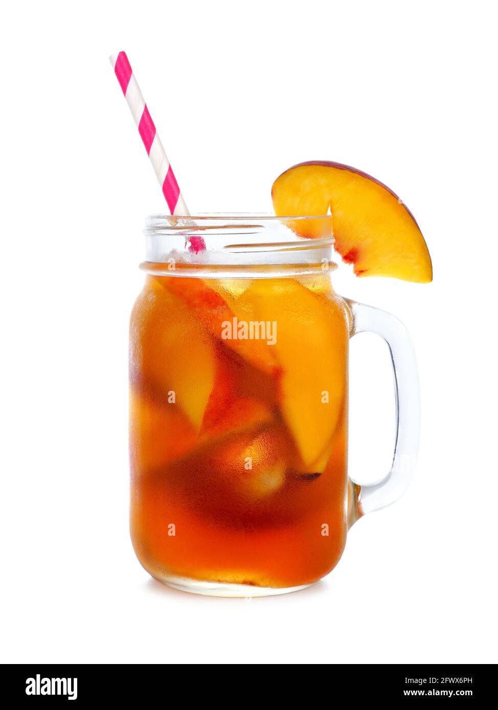Cool peach iced tea in a mason jar glass isolated on a white background Stock Photo