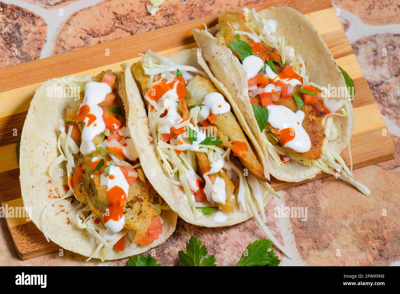 Baja California Style Fish Tacos With Toppings Stock Photo