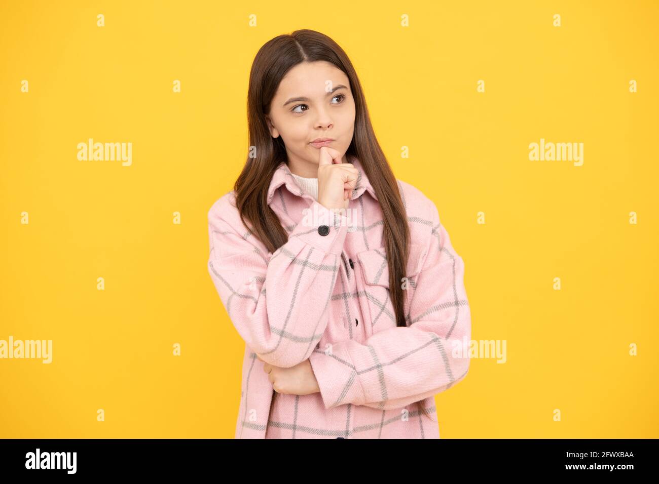 thoughtful look. tween child wear plaid shirt. chequered flannel jacket. beauty and fashion. Stock Photo