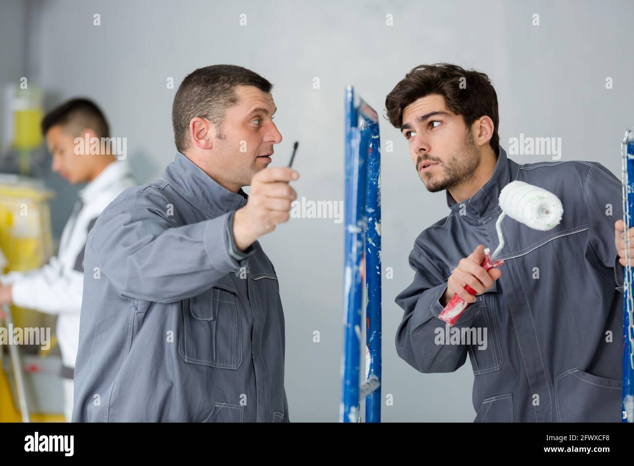 industrial painting contractor manager giving instructiosn Stock Photo