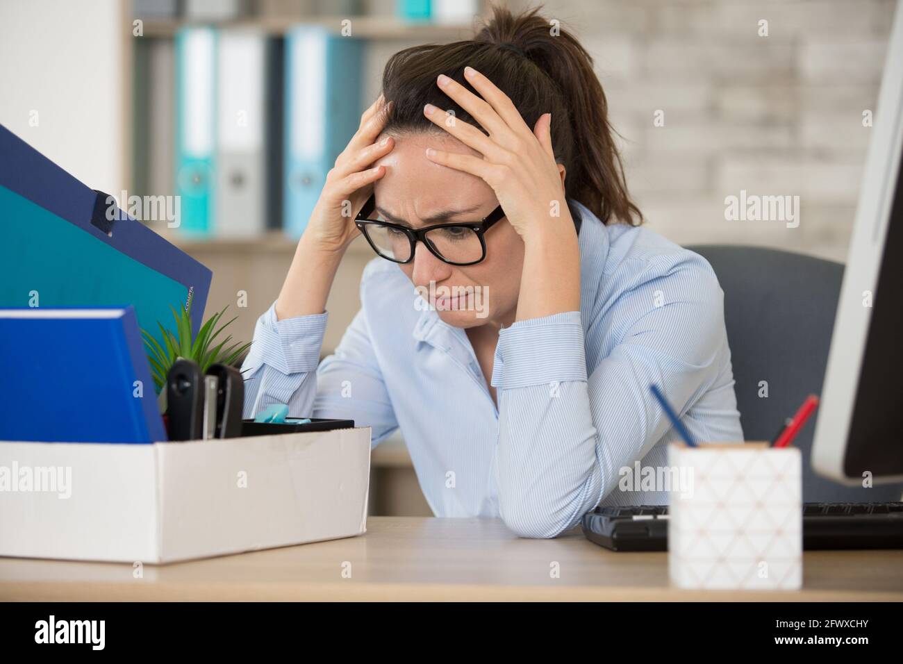 fired young woman feeling helpless Stock Photo