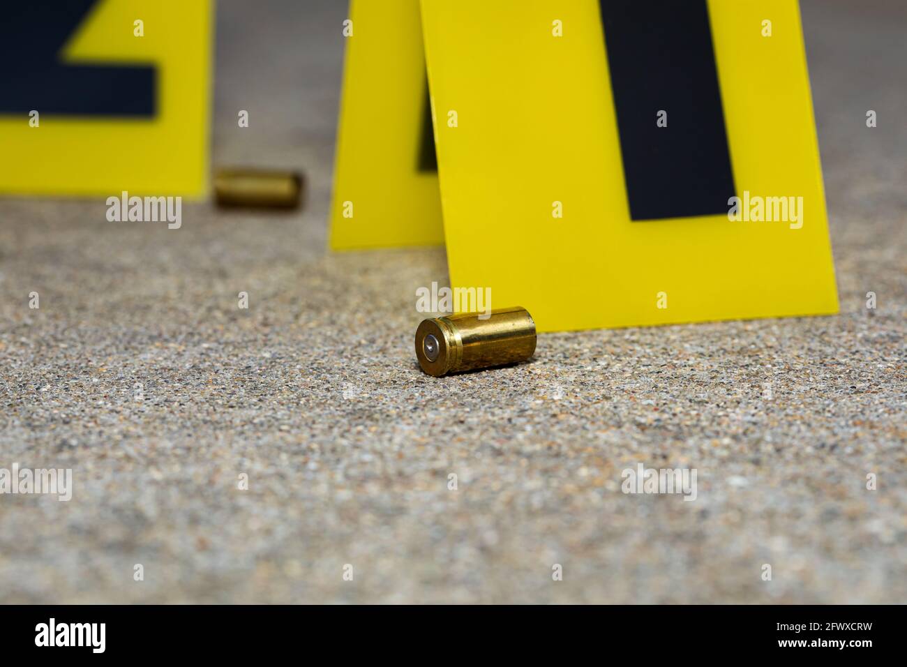 Gun shell casing at crime scene. Gun violence, mass shooting and homicide investigation concept. Stock Photo