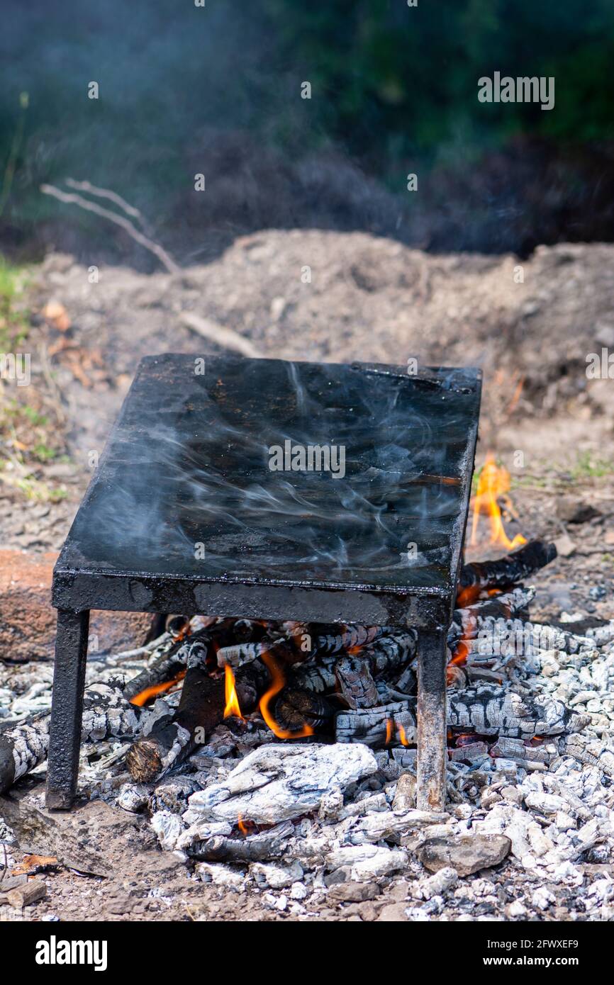 Empty stone grill plate in the nature Stock Photo