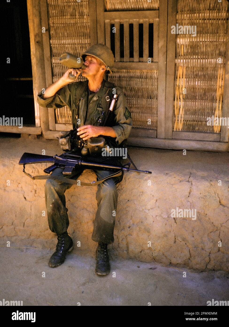 Sergeant Drinking from Canteen; Vietnam; 1965 Stock Photo