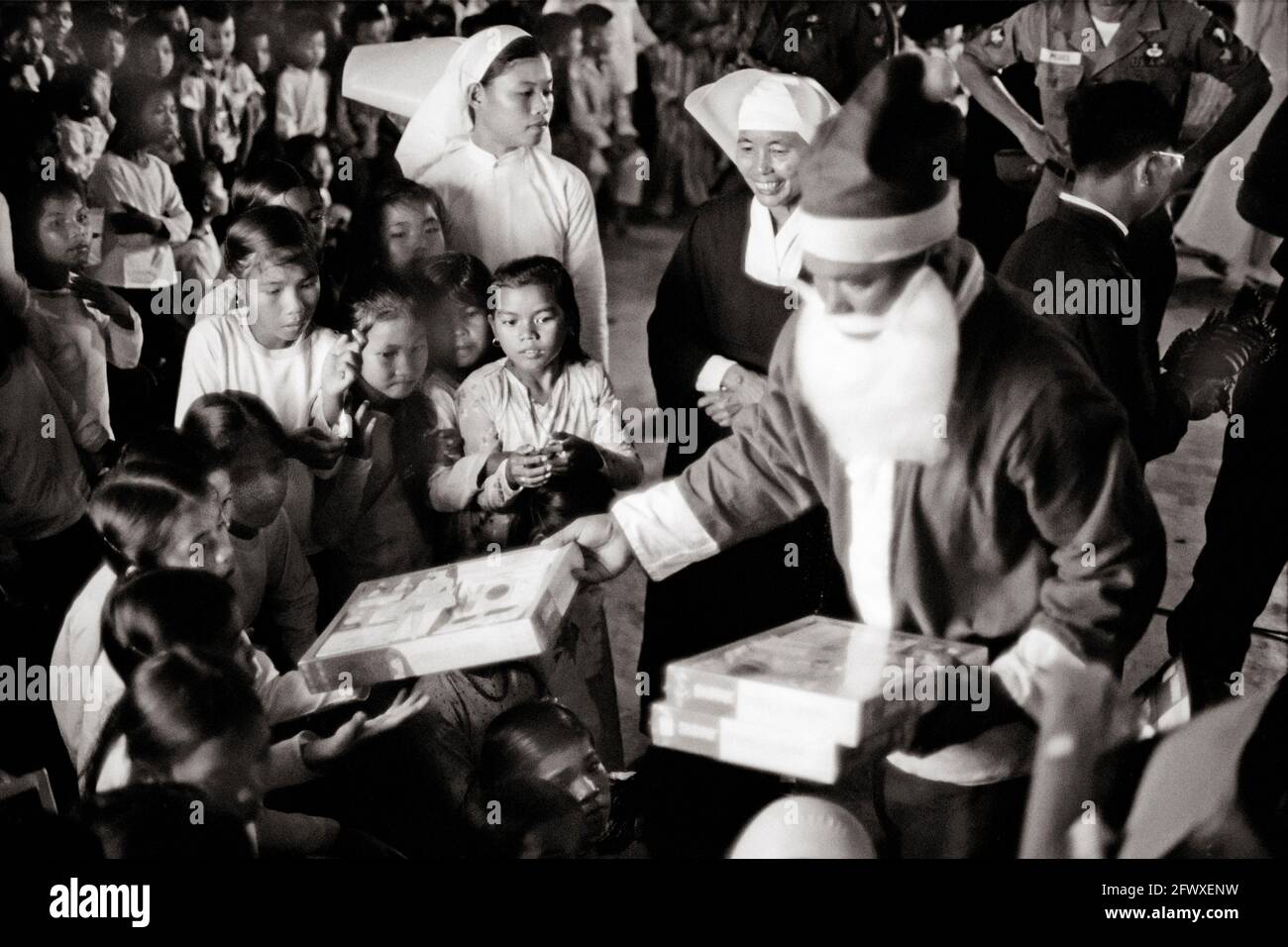 Vietnam Santa Claus Handing Out Toys Stock Photo