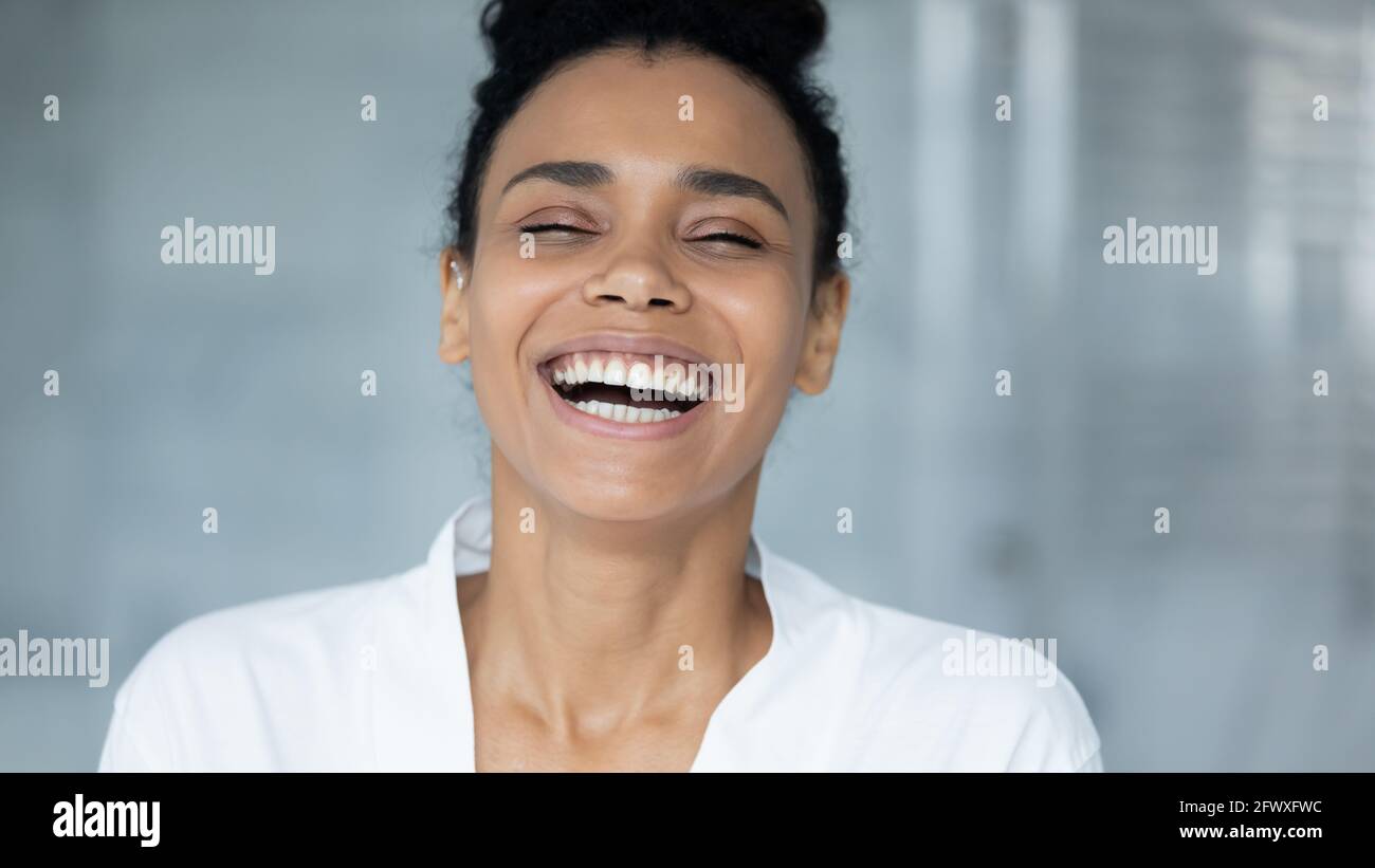 Excited happy African American girl in bathrobe looking at camera Stock ...