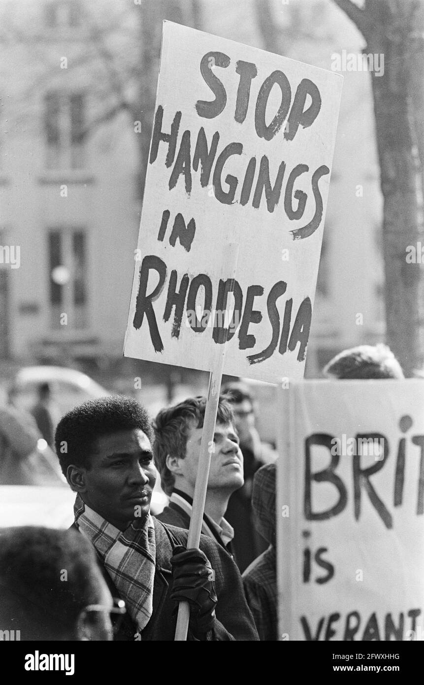 Protest march African students against regime. A student with sign ...
