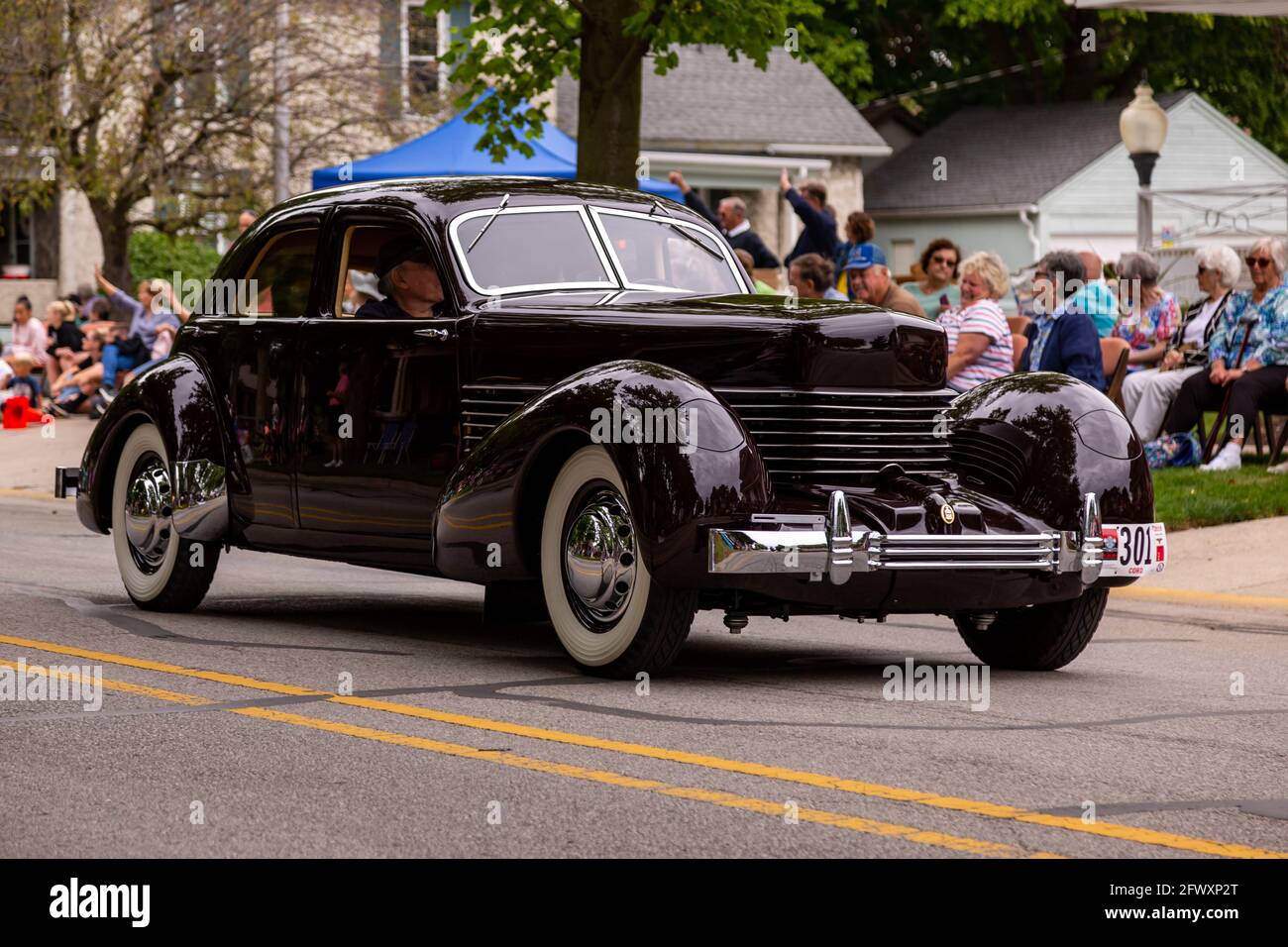 An antique Cord sedan classic automobile cruises through Auburn