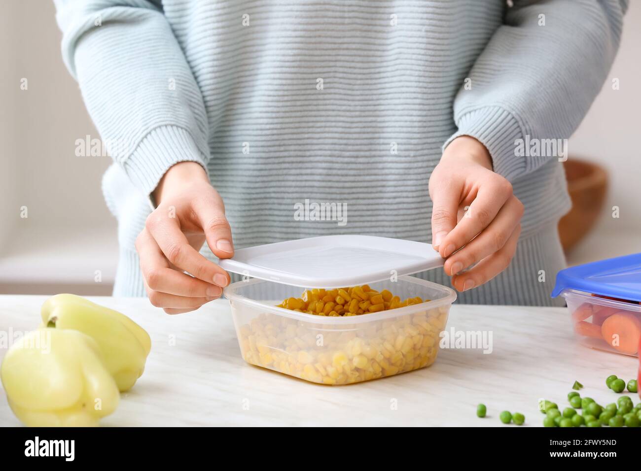 Container Closing Food Woman closing plastic container hi-res stock photography and images - Alamy